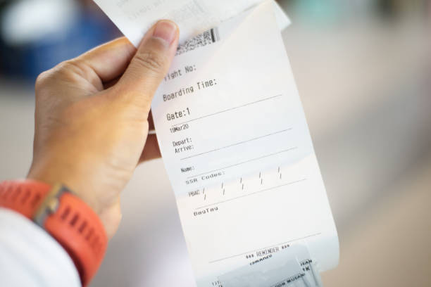 istock Blurred  Airline ticket in hand transportation concept. 1213880822