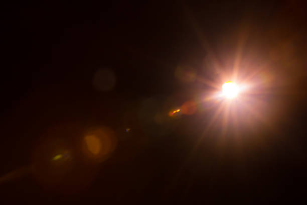 istock Abstract Natural Sun flare on the black 1213881754