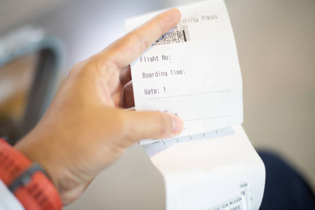 istock Blurred  Airline ticket in hand transportation concept. 1213881920
