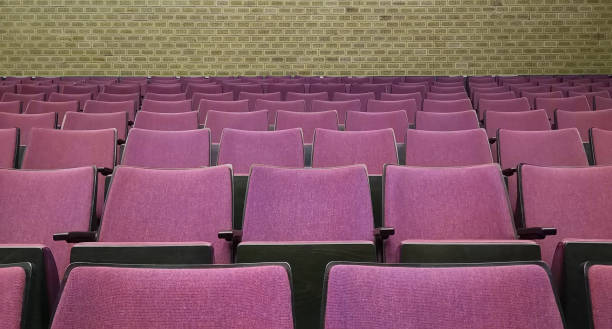 Empty rows of seats in theater,cinema,concert hall. Concept of quarantine,cancellation of mass events to prevent spread of coronavirus infection,financial losses of organizers in entertainment sector Empty rows of seats in auditorium or concert hall.Close up,selective focus.Concept of quarantine,curfew,cancellation of mass events to prevent coronavirus,losses of organizers in entertainment sector dancing school stock pictures, royalty-free photos & images