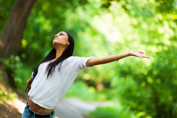 istock Young woman in a park 1213884465