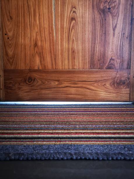 istock Carpet and wooden door 1213885638