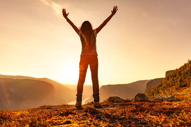 istock Happy woman in the great outdoors with sunlight 1213886457
