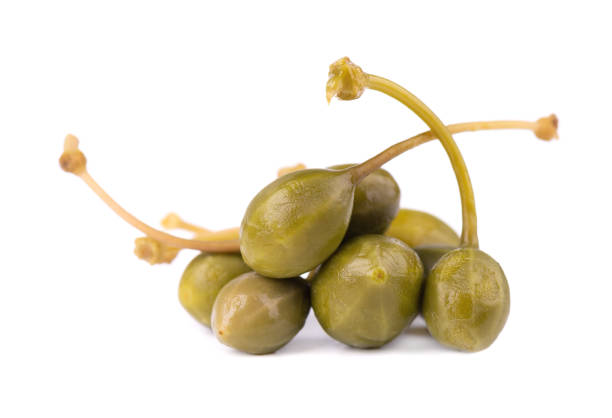 istock Capers isolated on white background. Pickled capers. Canned capers 1213888175
