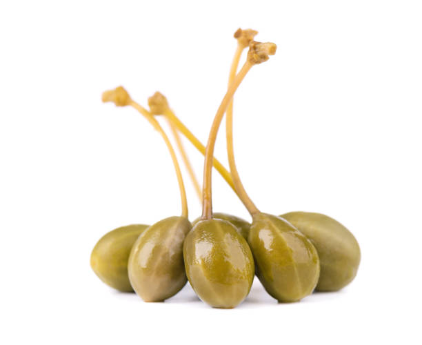 istock Capers isolated on white background. Pickled capers. Canned capers 1213888230