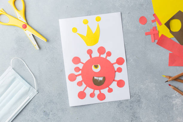 istock child hands make card collage with corona virus covid-19 1213890390