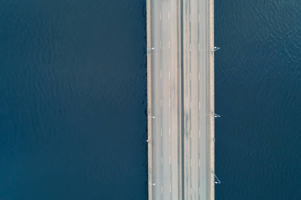 istock Aerial top view of water bridge with empty traffic. 1213890453