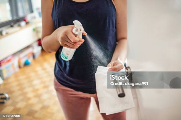 Girl Staying At Home During Coronavirus Outbreak Stock Photo - Download Image Now - Cleaning, Domestic Life, Disinfection