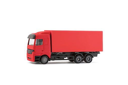 Red cargo delivery truck miniature isolated on white background with clipping path