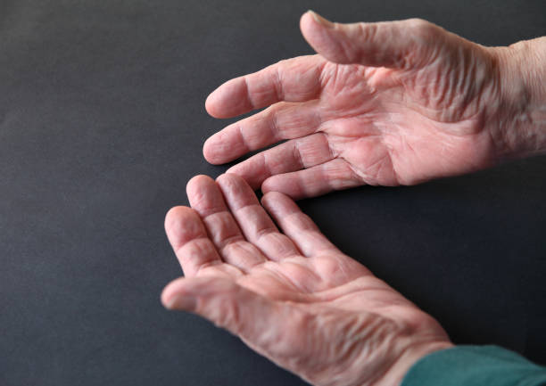 istock Male hands open on a dark background 1213894599
