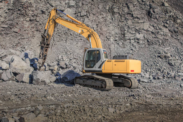 istock Tractor for crushing large stones in a quarry 1213897862