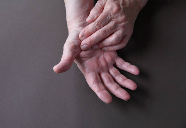 istock Man has pain on thumb with room for text 1213899589