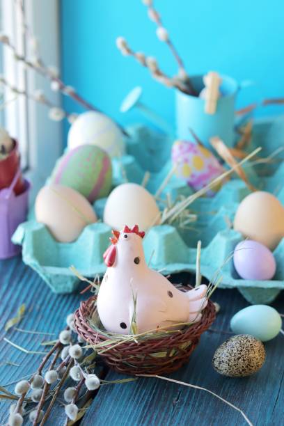 istock Easter toy chicken, eggs on a wooden windowsill, spring, festive home decor 1213900120