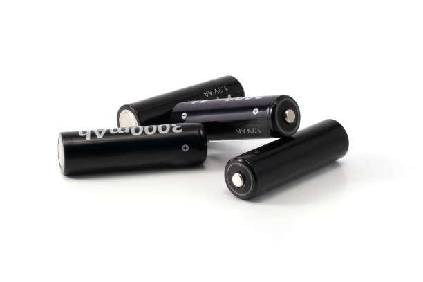 istock four black batteries isolated 1213901269