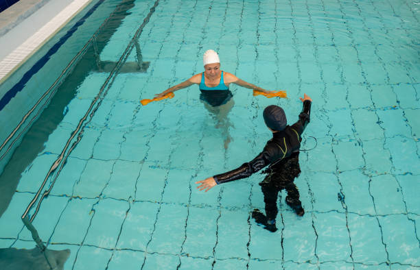 istock Patient doing exercises in hydrotherapy at a rehab center 1213902570