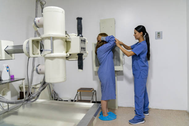 istock Radiologist preparing a patient for an x-ray exam 1213902602