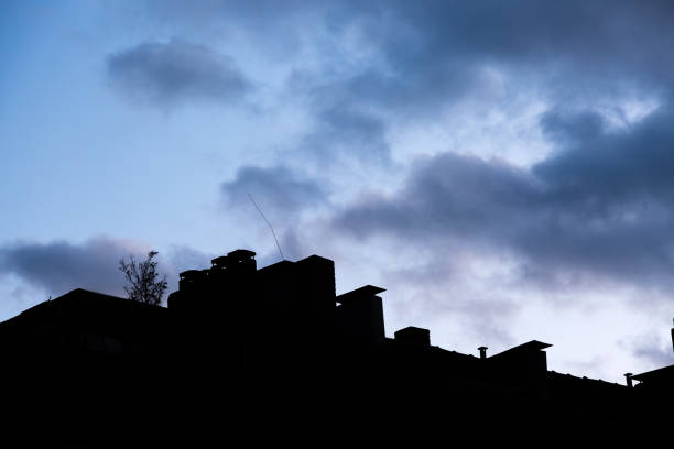 istock Silhouette of building and dramatic cloudy sky 1213904324