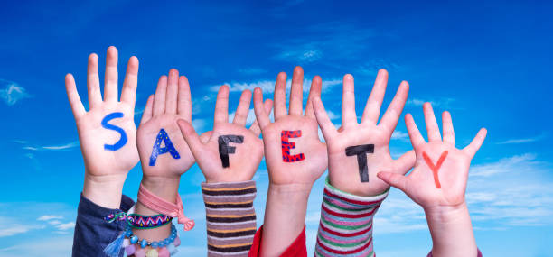 istock Children Hands Building Word Safety, Blue Sky 1213904590