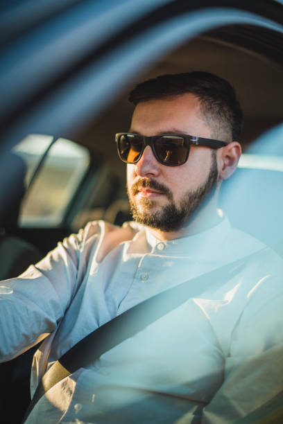 istock A man with sunglasses in the car 1213910352