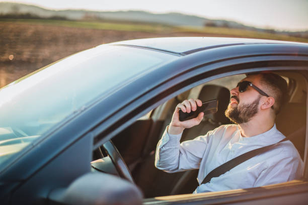 istock A man sings in a car 1213911058