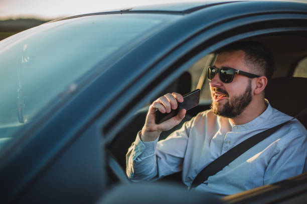 istock A man sings in a car 1213911168
