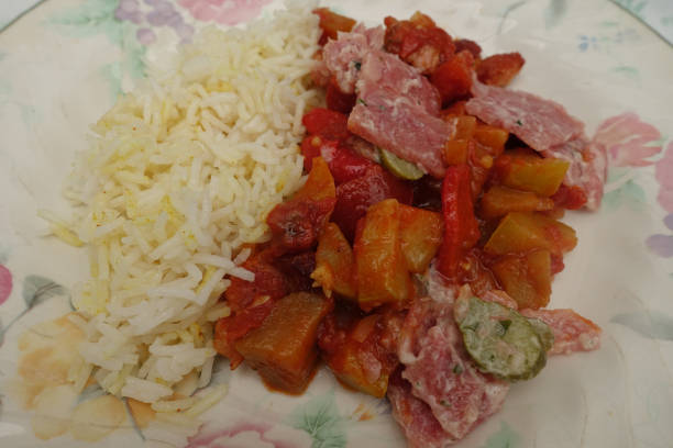 istock Ratatouille with pork served with basmati rice 1213911440