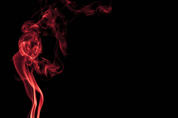 Abstract red smoke swirling on a black background with a copy space on the right side.