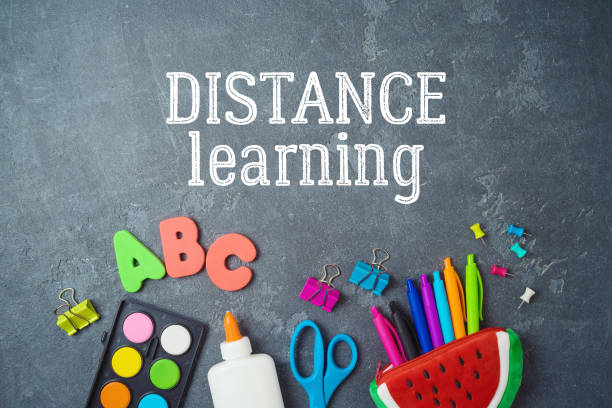 istock Distance learning and education concept. Study online from home with top view table and school supplies. 1213914998