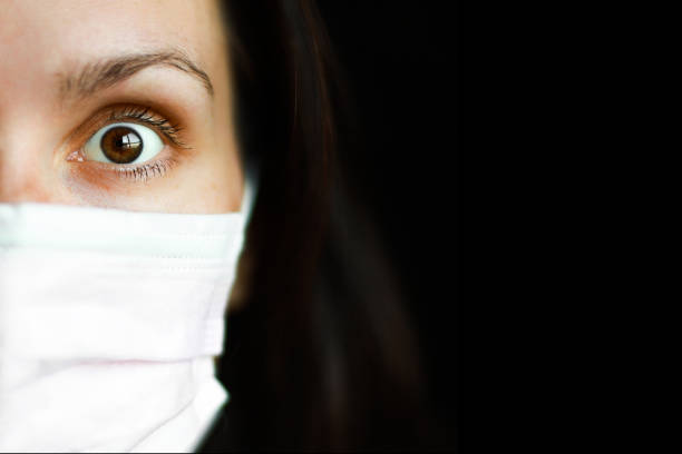 istock medical mask with an eye close up 1213915102