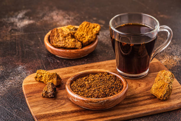 Chaga tea Chaga tea - a strong antioxidant, boosts immune system, has detox quality, improves digestive. basidiomycota stock pictures, royalty-free photos & images