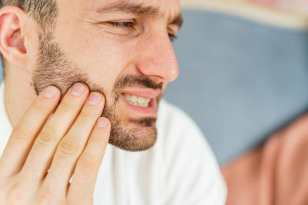 istock Sad male suffering from a severe toothache 1213917729