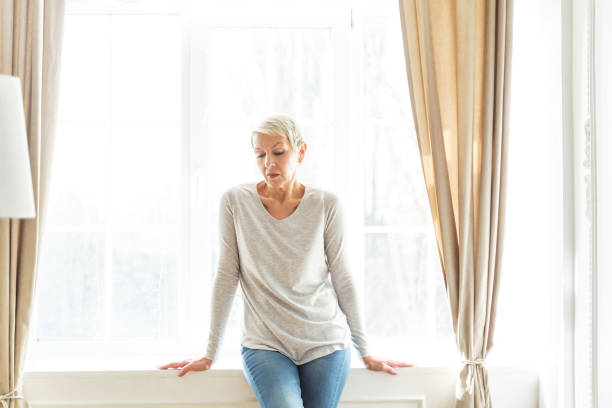 istock Depressed grey-haired elderly Caucasian lady looking down 1213917946