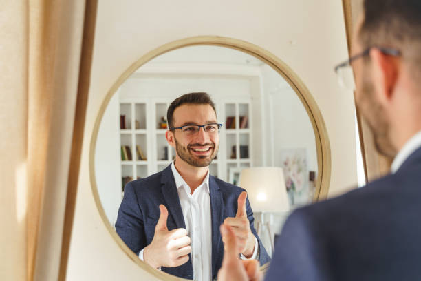 istock Man in a tweed jacket staring at himself 1213918015