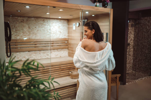 istock Happy woman enjoying time in sauna 1213920489