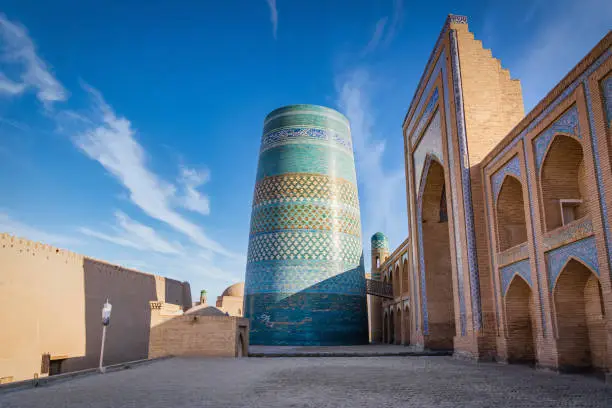 Photo of Kalta Minor Minaret and Muhammad Amin Khan Madrasa Khiva Uzbekistan
