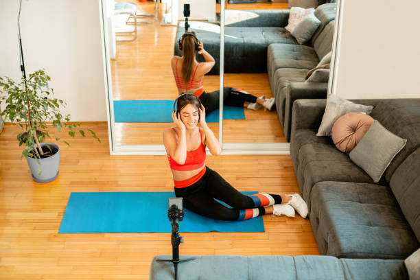 istock Attractive woman training at home 1213922552