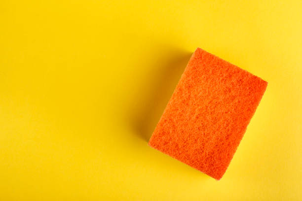 istock new bright wash sponge on a yellow background. 1213928646