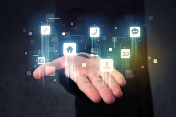 istock Businessman holding blue applications 1213928729