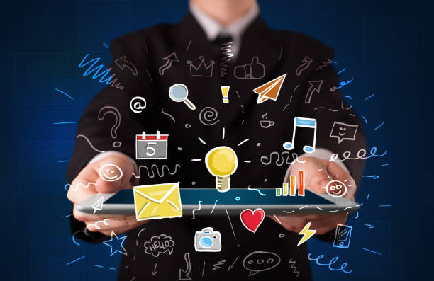 istock Businessman holding tablet with apps 1213928801