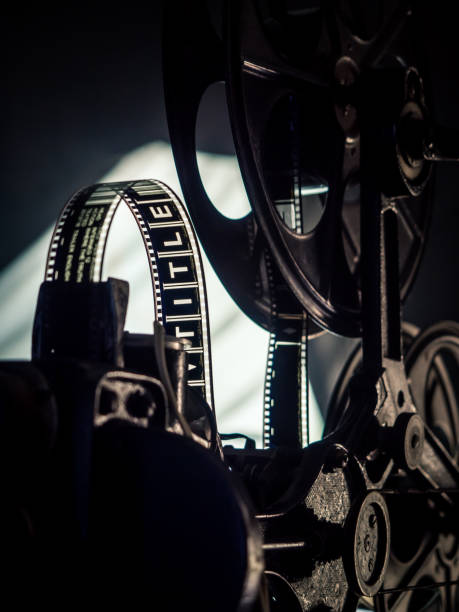 istock Old vintage movie projector on a dark background 1213929865