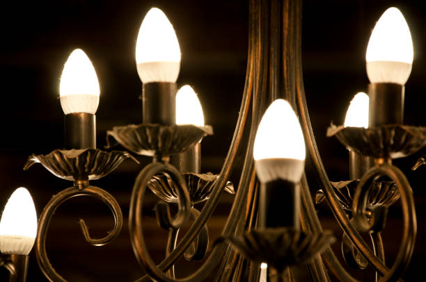 istock Simply Illuminating. Classic overhead interior design. Electric lamp hanging from ceiling. Old ceiling lamp. Vintage antique chandelier. Retro style lighting fixture. Providing lighting 1213931049