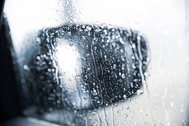 istock Heavy rain running off a driver's window 1213931242