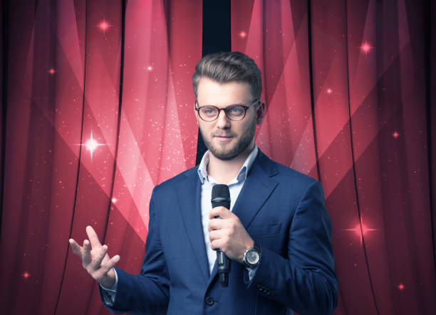 istock Businessman holding microphone 1213931938