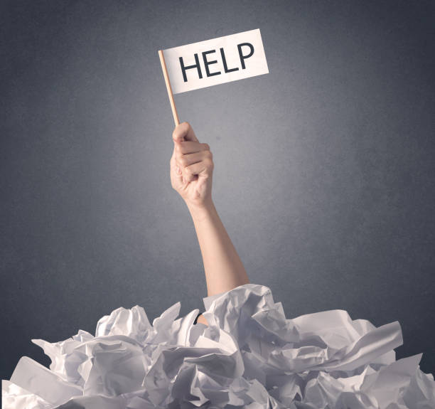 istock Female hand holding help sign 1213933317