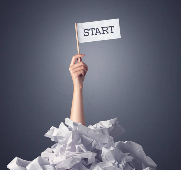 istock Female hand holding start sign 1213933359