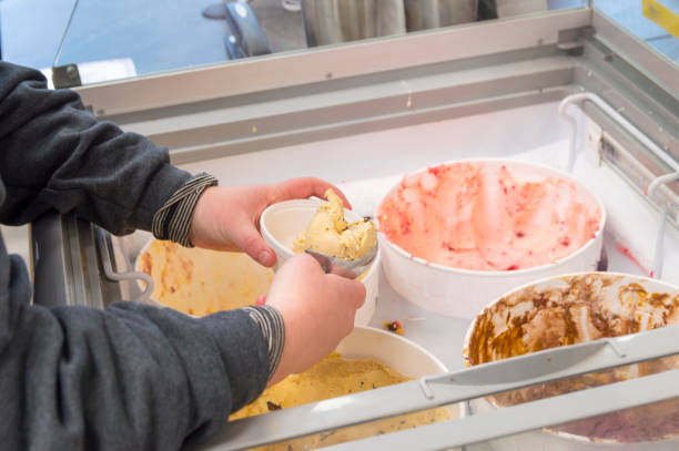 Scooping Up Ice Cream in a Shop