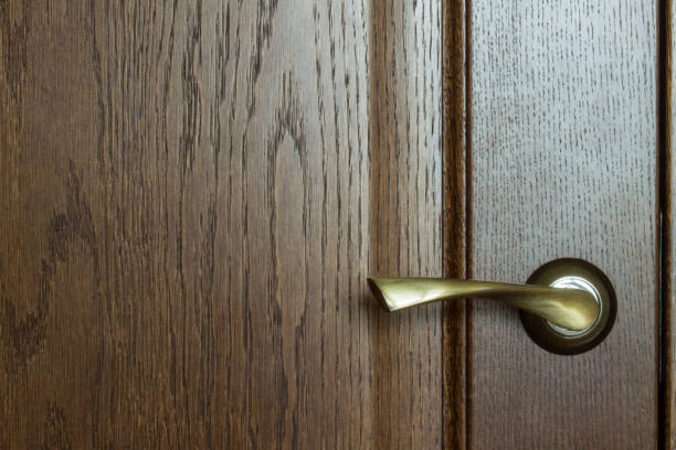 istock door with a metal door handle close-up 1213933497