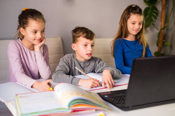 istock Children together at home learning 1213933741