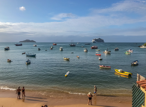 Búzios / Rio de Janeiro /Brazil - January 19, 2020:This beach is located in the center of Buzios, next to the famous Rua das Pedras, has a narrow strip of sand, due to the houses, inns, bars and restaurants, built very close to the sea.  The waters are generally calm and warm, possessing many fishing boats.