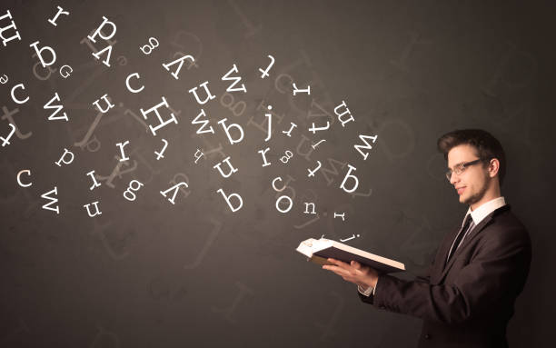 istock Young man holding book with letters 1213937229